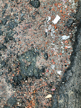 The damaged road surface in the rainy season.の写真素材