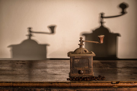 Old coffee grinder on old wood Trunkの写真素材