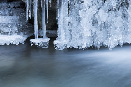 Icicle of beautiful frozen waterfall in the winter seasonの写真素材