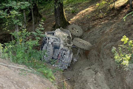 Stuck Offroad vehicle scaling uphill through mud with car winchの写真素材