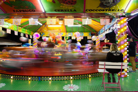 Carousel in the night - Mummy waiting in Luna park.
