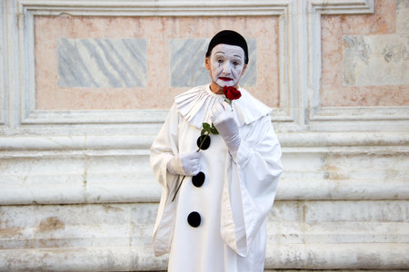 Beautiful Male Pierrot Mask with Rose at Venice Carnivalのeditorial素材