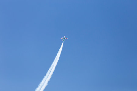 Flight of reactive plane with a lot of white smoke, Grado, Italyのeditorial素材