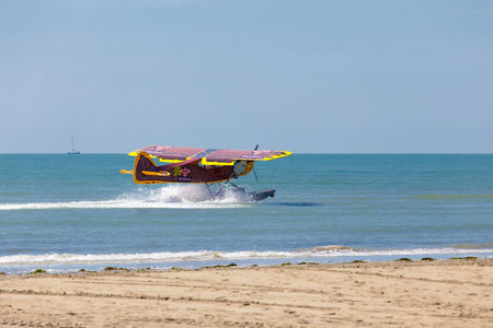 Ultralight amphibious aircraft landing on the sea coast Grado, Italyのeditorial素材