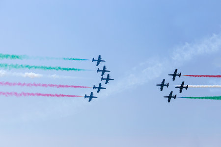 Airshow of Frecce Tricolori - Italian acrobatic aircraft team exhibition, Grado beach, Italyのeditorial素材