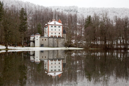 Winter idyllic landscape with reflection of castle Sneznik, Sloveniaのeditorial素材