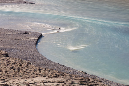 Diagonal line of river coast, Empty accumulation lake, Most na Soci, Slovenia, water backgroundの写真素材