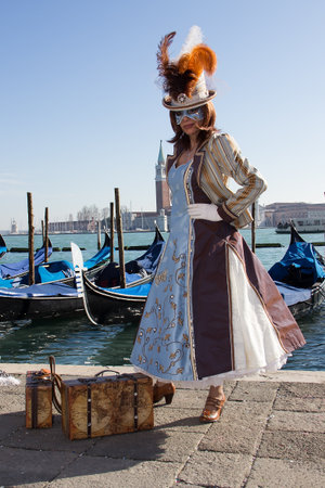 Venetian Mask - Beautiful Woman with Gondolas on Venice Carnivalのeditorial素材