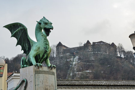 Ljubljana castle in the background of the Dragon bridgeの写真素材