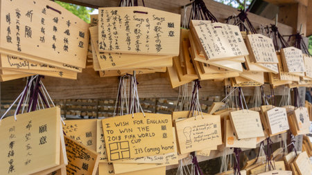 Tokyo, Japan - August 2018: Close up of wooden boards or Ema with wishes written on them by visitors at Meiji Shrineのeditorial素材