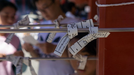 Tokyo, Japan - August 2018: Tied Omikuji - Paper Fortune at Sensoji Asakusa Kannon Temple on a sunny dayのeditorial素材