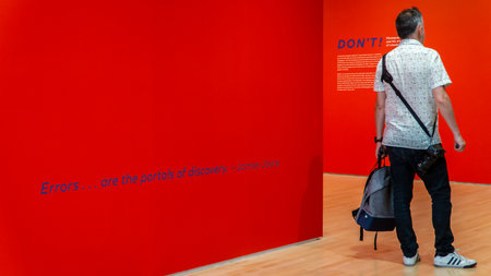 San Francisco, USA - August 2019: Guy visiting Photography and Art of Mistakes exhibition in San Francisco Museum of Modern Artsのeditorial素材