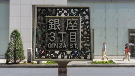 Tokyo, Japan - August 2018: Street sign for Ginza street made of metal and stoneのeditorial素材