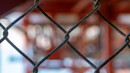 San Francisco, USA - August 2019: Wire fence with blurry background symbolizing togethernessの写真素材