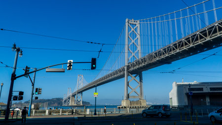 San Francisco, USA - August 2019: Wide shot of Bay Bridge during day with traffic lights and electric wiresのeditorial素材