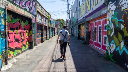 San Francisco, USA - August 2019: Man walking on Mission street on a summer dayのeditorial素材