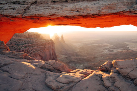 Sunrise at Mesa Arch in Canyonlands National Park near Moab, Utah.の写真素材