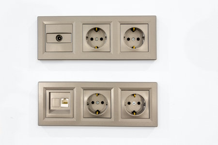 four electrical outlets, input tv and internet on the white wall