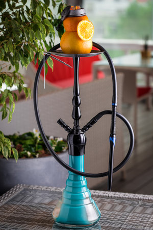 modern hookah with fruit bowl on the table