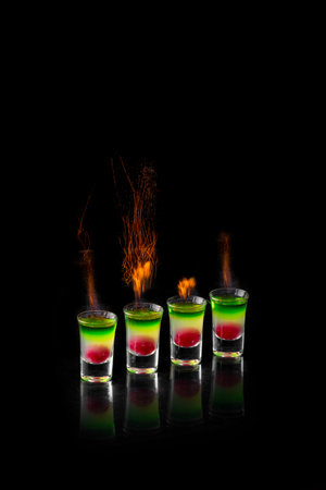alcohol cocktail with fire on a black background is insulatedの写真素材