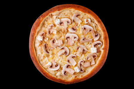 pizza with cheese mushrooms top view on black backgroundの写真素材