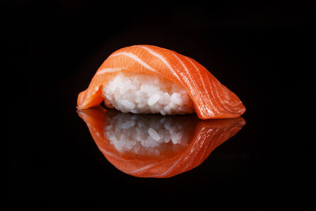 classic sushi with salmon on a black backgroundの写真素材
