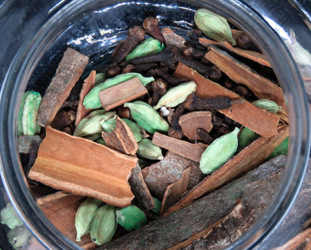 Close up image of cardamom clove and cinnamon with black background.の写真素材