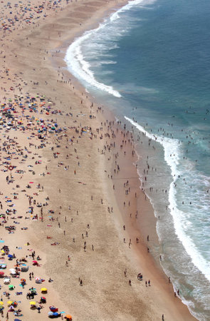 Sunny day in Nazare with a lot of people on the beach
の写真素材