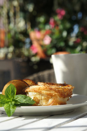 Sweet cakes and beautiful rich decorated summer terrace    の写真素材