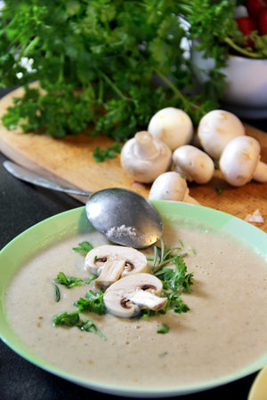 Fresh mushroom champignon soup prepared in blender in the kitchenの写真素材