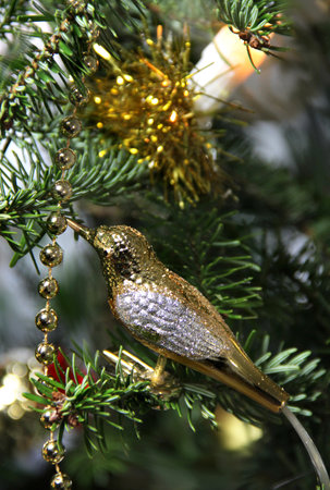 Beautiful Christmas tree decorated with candles, golden bird and bow
の写真素材