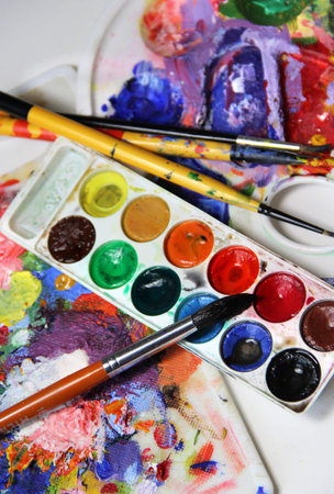 Art palette and brushes with a lot of vivid colors    の写真素材