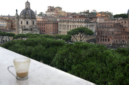 Beautiful view of Rome and cup with cafe latte, Italy の写真素材