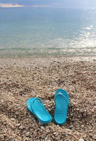 Clear sea water of Adriatic sea and blue summer  shoes, Croatiaの写真素材