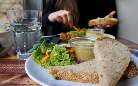 Beautiful portion of hummus and vegetable saladの写真素材