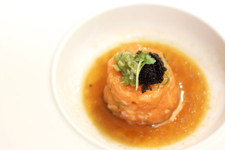 Portion of salmon tartare from professional Japan cookの写真素材