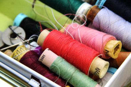 Big mix of multicolored sewing threadsの写真素材