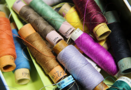 Big mix of multicolored sewing threadsの写真素材