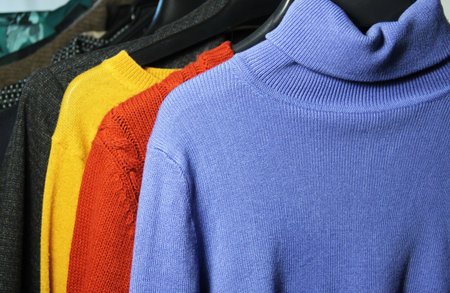 Mix of vivid multicolored knitwear in the dressing roomの写真素材