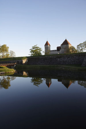 Medieval castle with reflection from the lakeの写真素材