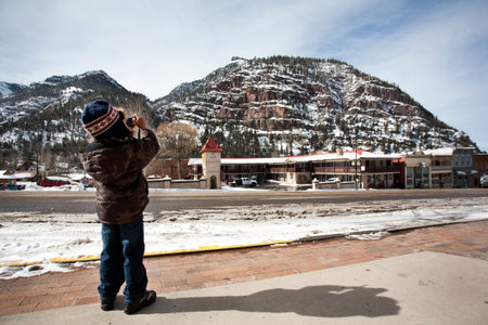 A little boy taking picture of beautiful view in Ouray,Coloradoの写真素材