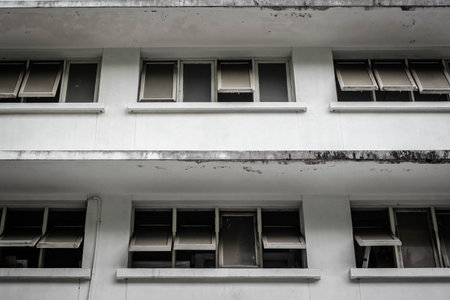 Front of old building with ancient windowsの写真素材