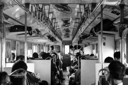 CHACHOENGSAO, THAILAND - MARCH 13, 2016: Black and white picture of passengers on the train.のeditorial素材