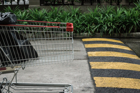 Cart crossing speed bump on the road.の写真素材