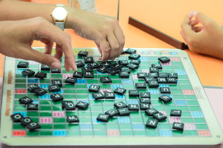 CHONBURI, THAILAND - AUGUST 28, 2017: Student playing scrabble cross word in school.のeditorial素材
