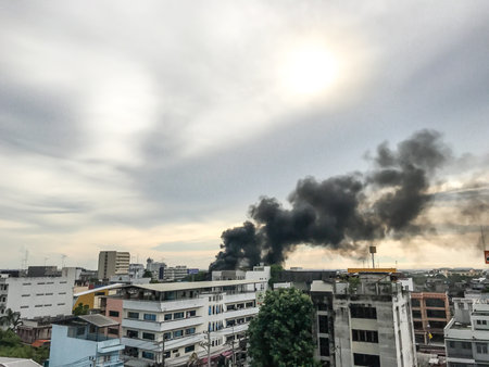 CHONBURI, THAILAND - June 28, 2017: The black smoke  from the fire is above the building.のeditorial素材