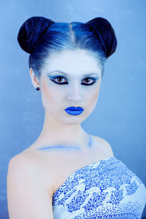 Closeup portrait of beautiful lady in blueの写真素材