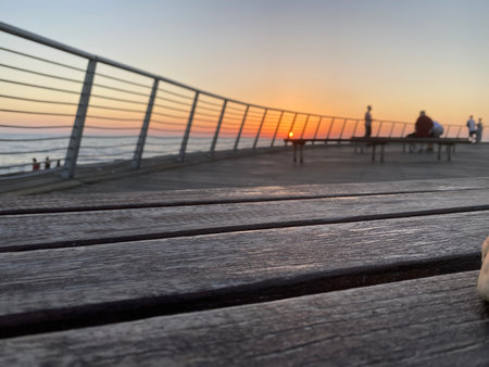 Romantic sunset over the sea on the promenadeの写真素材