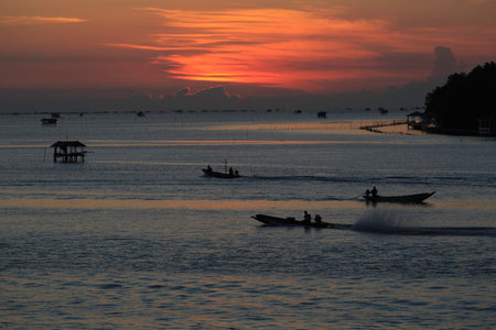the landscape photo of fishing village in sunrise, the famous place for travel in Thailandの写真素材