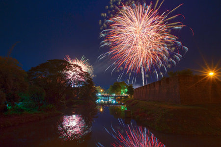 Fireworks in the festivities and old brick walls on the river.の写真素材